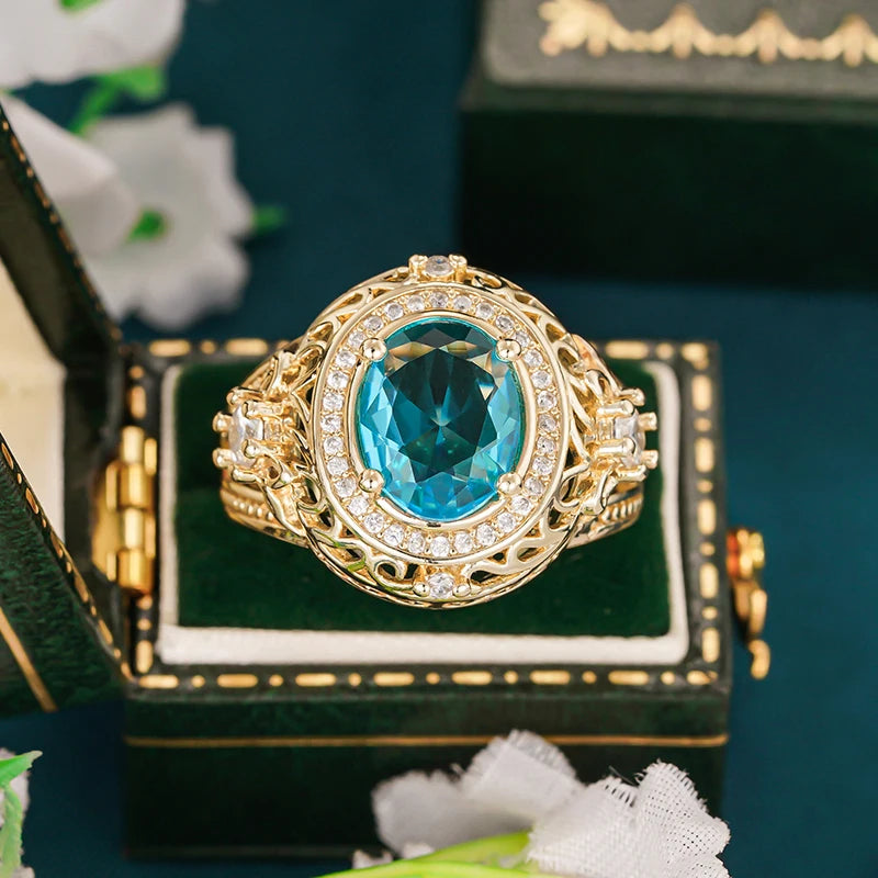 Gorgeous Women Rings with Oval Blue Cubic Zirconia Hollow Out Gold Color Wedding Band Accessories Lady Jewelry for Party