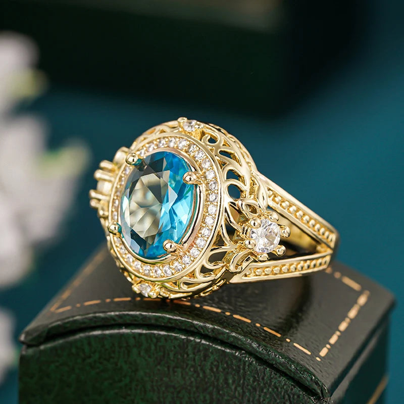 Gorgeous Women Rings with Oval Blue Cubic Zirconia Hollow Out Gold Color Wedding Band Accessories Lady Jewelry for Party