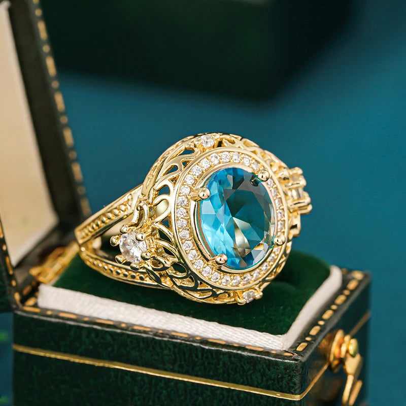 Gorgeous Women Rings with Oval Blue Cubic Zirconia Hollow Out Gold Color Wedding Band Accessories Lady Jewelry for Party